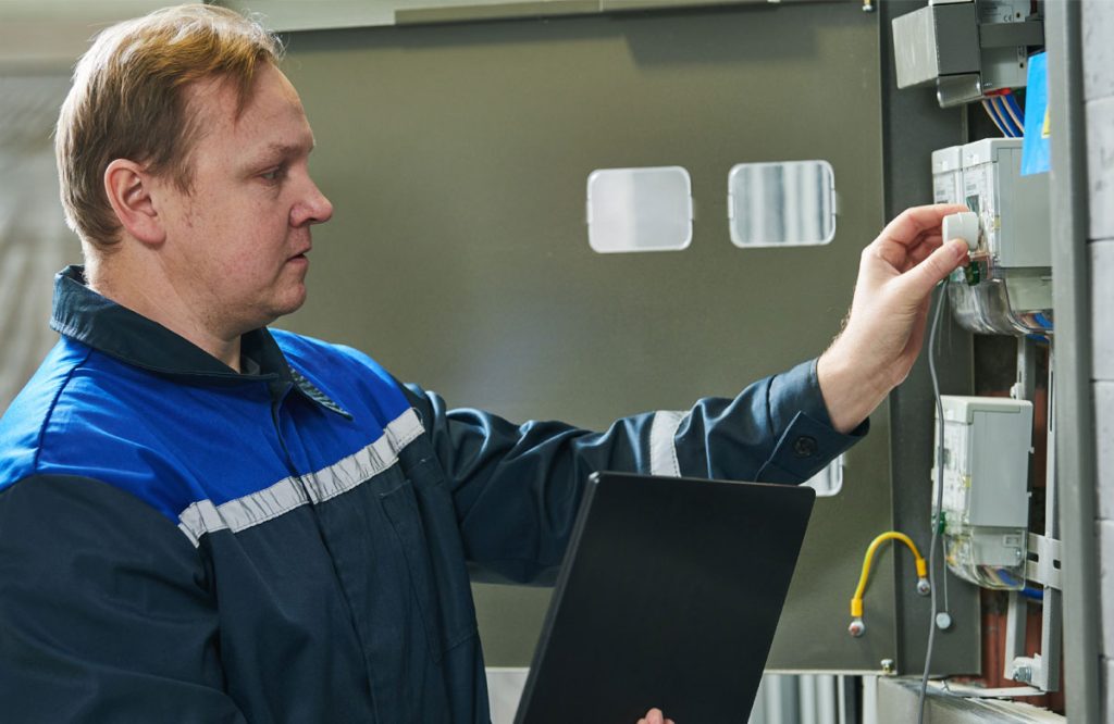 technician monitoring a commercial system commercial electrical services